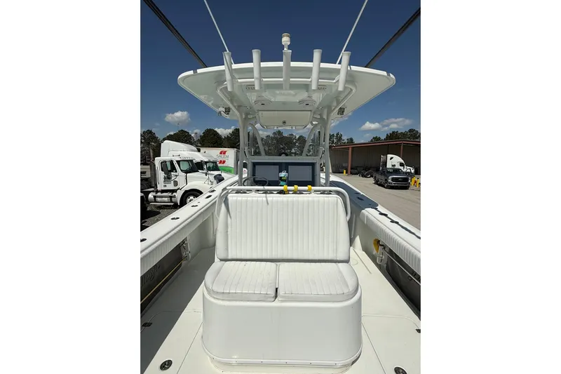 Cut Loose Yacht Photos Pics 2013 Yellowfin 32 Offshore boat interior with seating and console, parked outdoors.
