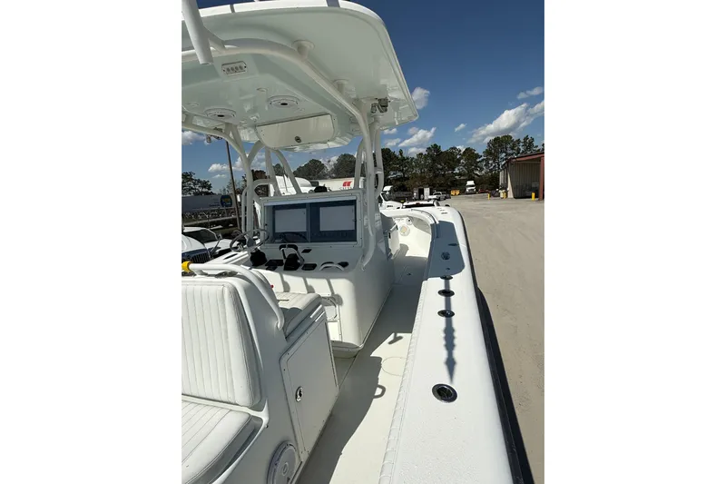 Cut Loose Yacht Photos Pics 2013 Yellowfin 32 Offshore boat interior with navigation screens and seating.