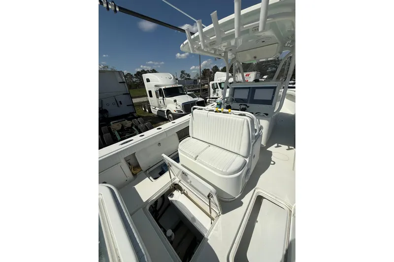 Cut Loose Yacht Photos Pics 2013 Yellowfin 32 Offshore boat interior with seating and control panel.