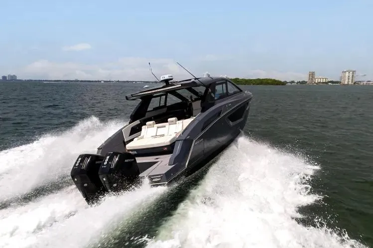  Yacht Photos Pics 2023 Cruisers 42 GLS OB yacht speeding on open water.