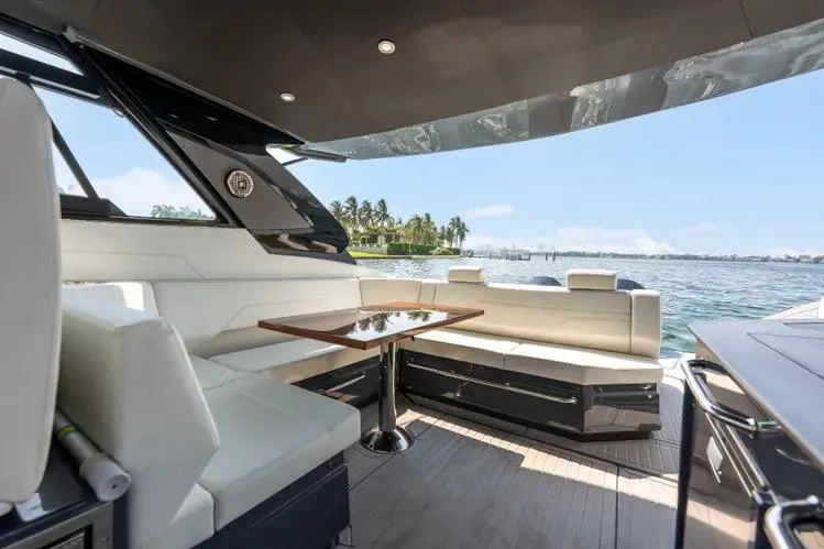  Yacht Photos Pics Luxurious 2023 Cruisers 42 GLS OB yacht interior with elegant seating and scenic ocean view.