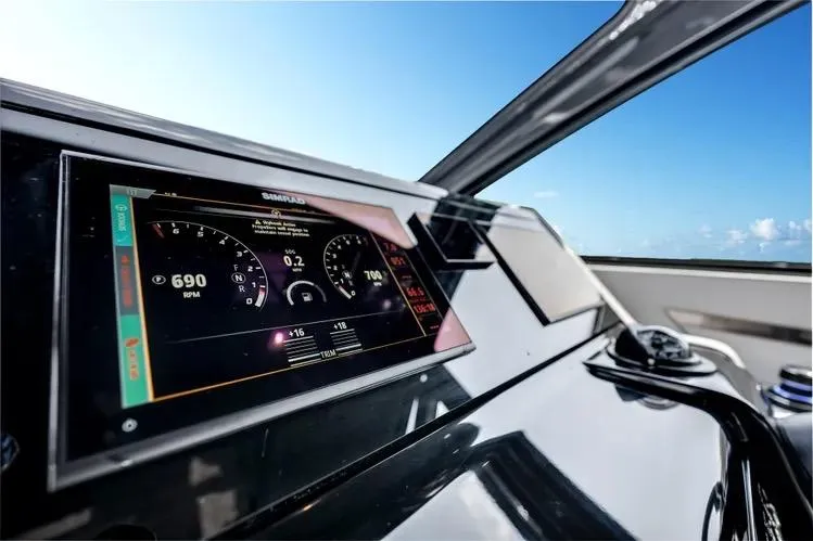 Yacht Photos Pics 2023 Cruisers 42 GLS OB dashboard with digital display, clear sky background.