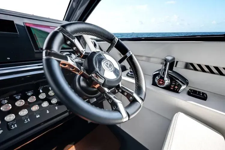  Yacht Photos Pics Steering wheel and controls of 2023 Cruisers 42 GLS OB yacht, ocean view.