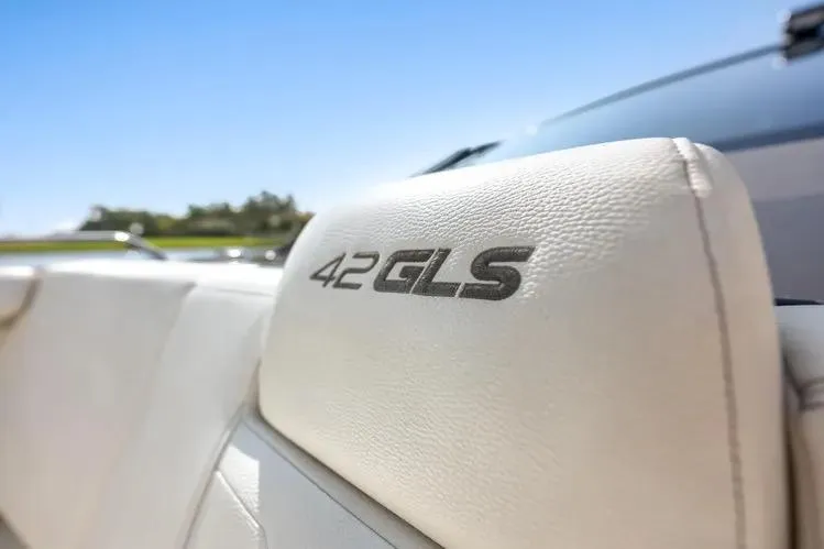  Yacht Photos Pics 2023 Cruisers 42 GLS OB boat seat with logo, sunny day background.