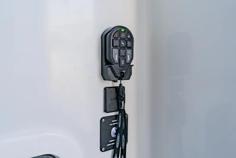  Yacht Photos Pics Control panel on 2025 Yellowfin 36 Offshore boat, featuring modern navigation buttons.