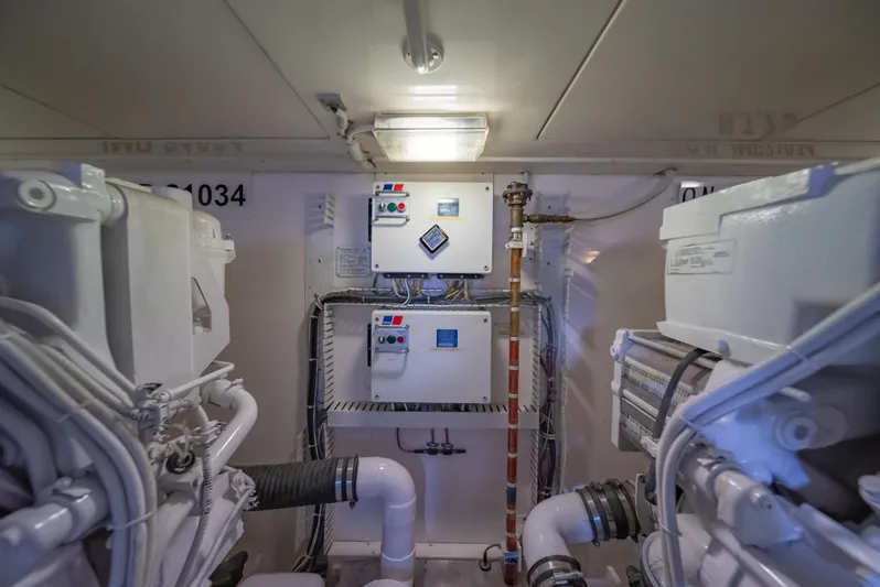 Jobsite Yacht Photos Pics Engine room of a 2009 Bertram 630 yacht with control panels and machinery.