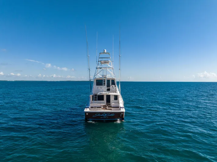 Jobsite Yacht Photos Pics 2009 Bertram 630 yacht on open ocean under clear blue sky.