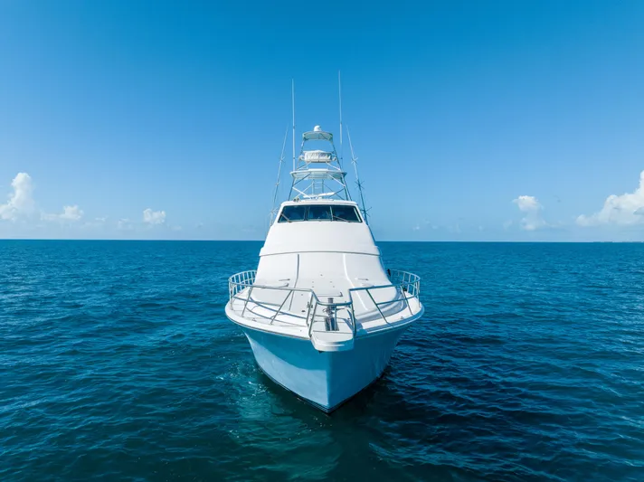 Jobsite Yacht Photos Pics Front view of a 2009 Bertram 630 yacht cruising on the open sea.