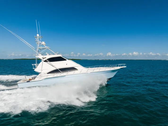 Jobsite Yacht Photos Pics 2009 Bertram 630 yacht cruising on open blue ocean.