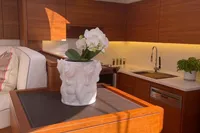 Luxurious 2022 Solaris 64 RS yacht interior with modern kitchen and elegant decor.