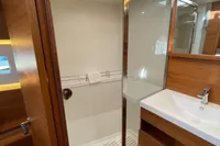 Luxurious bathroom in 2022 Solaris 64 RS yacht with modern shower and sink.