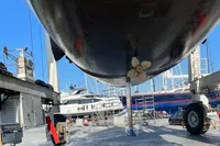 Underwater view of Solaris 64 RS yacht in dry dock, showcasing propeller and hull.