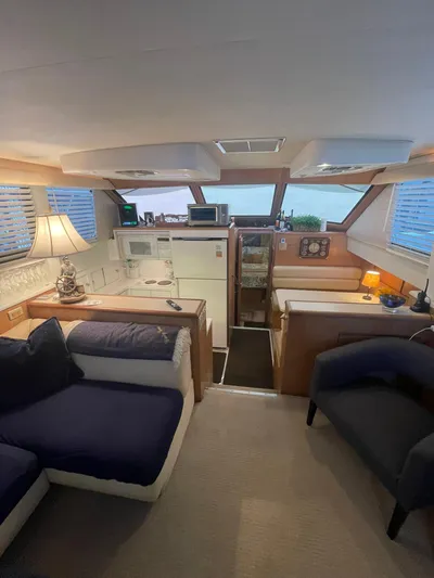 Lady Grace Yacht Photos Pics Interior of 1995 Hatteras 52 Motor Yacht, featuring cozy seating and modern amenities.