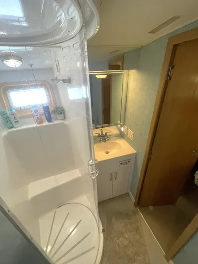 Lady Grace Yacht Photos Pics Bathroom interior of 1995 Hatteras 52 Motor Yacht with shower and vanity.