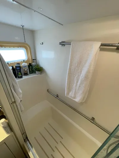 Lady Grace Yacht Photos Pics Bathroom of 1995 Hatteras 52 Motor Yacht with towel and toiletries.