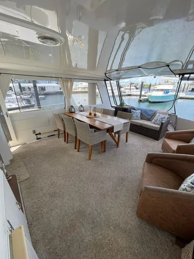 Lady Grace Yacht Photos Pics Spacious interior of 1995 Hatteras 52 Motor Yacht with elegant dining and seating area.