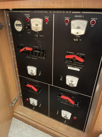 Lady Grace Yacht Photos Pics Electrical panel on a 1995 Hatteras 52 Motor Yacht, featuring switches and meters.