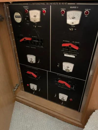 Lady Grace Yacht Photos Pics Electrical panel on a 1995 Hatteras 52 Motor Yacht, featuring voltage meters and switches.