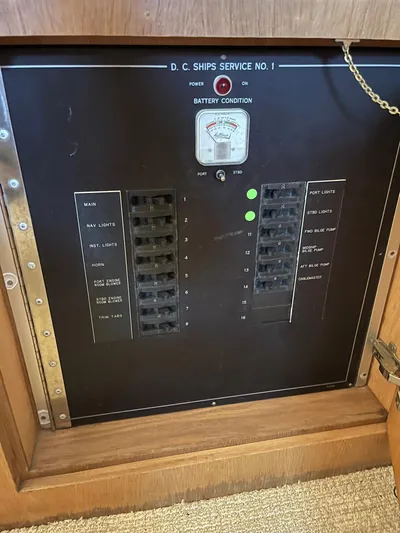 Lady Grace Yacht Photos Pics Electrical panel on a 1995 Hatteras 52 Motor Yacht, showing circuit breakers and battery condition.