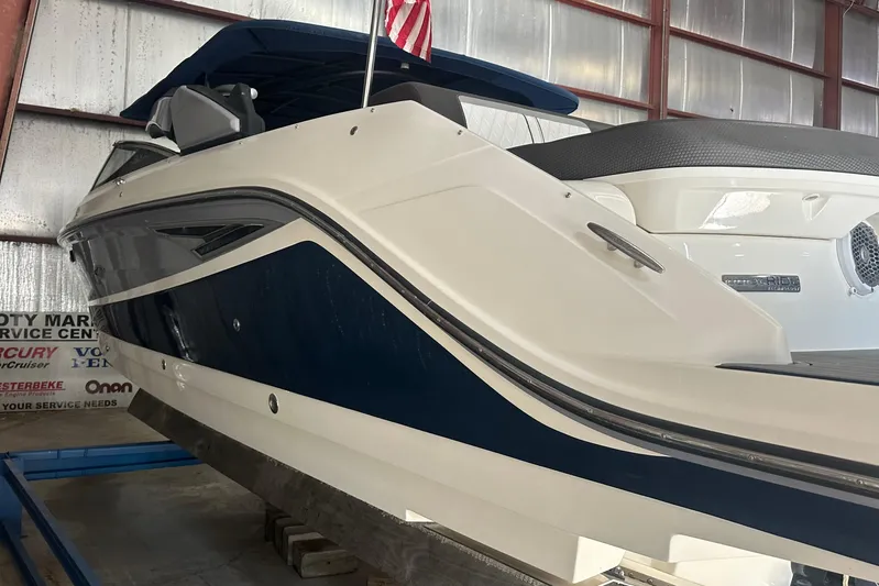  Yacht Photos Pics 2017 Sea Ray 280 SLX boat in storage, featuring sleek design and blue accents.