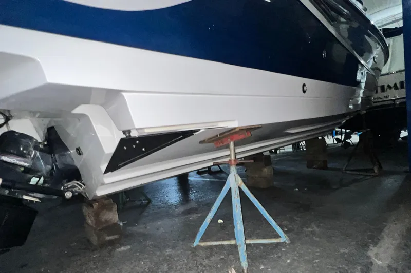  Yacht Photos Pics 2017 Sea Ray 280 SLX boat on stands in a garage.