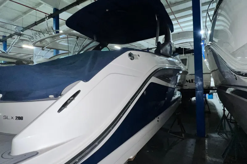  Yacht Photos Pics 2017 Sea Ray 280 SLX boat in indoor storage, side view.