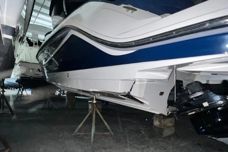  Yacht Photos Pics 2017 Sea Ray 280 SLX boat in storage, showcasing sleek design and powerful engine.