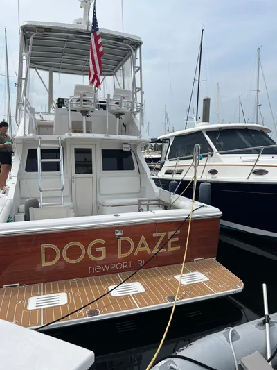 Dog Daze Yacht Photos Pics Jupiter 35 Convertible boat "Dog Daze" docked in Newport, RI marina.