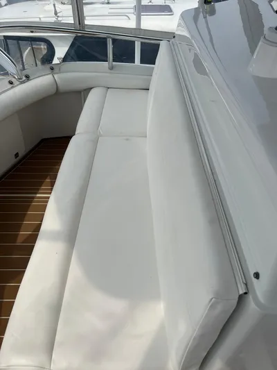 Dog Daze Yacht Photos Pics White seating area on a 2001 Jupiter 35 Convertible boat deck.