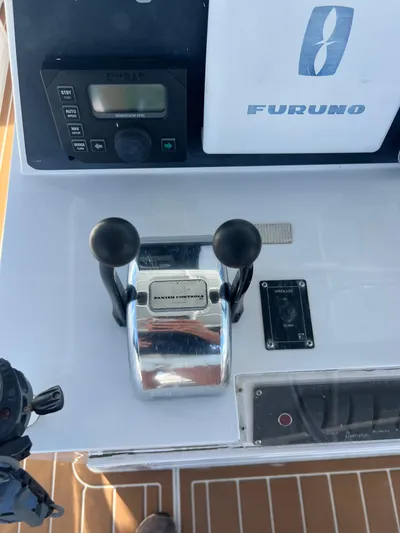 Dog Daze Yacht Photos Pics Control panel of a 2001 Jupiter 35 Convertible boat with Furuno equipment.