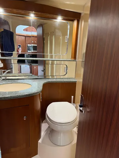 Dog Daze Yacht Photos Pics Luxurious bathroom in a 2001 Jupiter 35 Convertible yacht with modern fixtures.