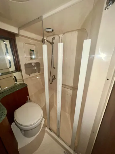 Dog Daze Yacht Photos Pics Bathroom in 2001 Jupiter 35 Convertible yacht with shower and toilet.