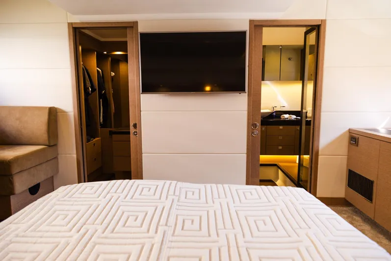  Yacht Photos Pics Interior of 2018 Prestige 560 Flybridge yacht with modern bedroom and ensuite bathroom.