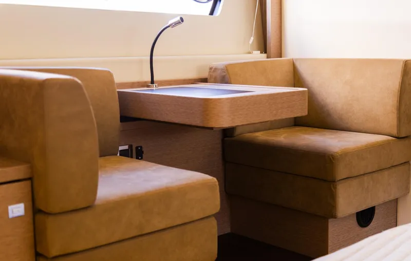  Yacht Photos Pics Luxurious seating area inside 2018 Prestige 560 Flybridge yacht with modern design.