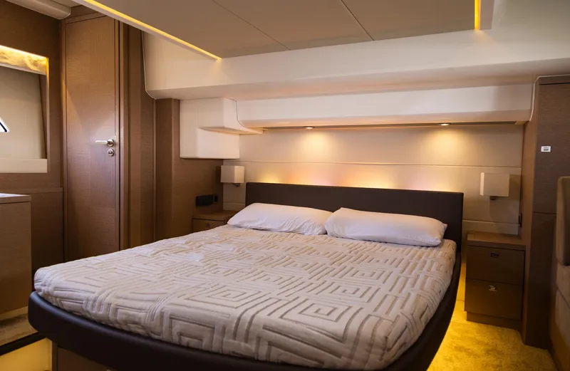  Yacht Photos Pics Luxurious bedroom interior of 2018 Prestige 560 Flybridge yacht with modern design.
