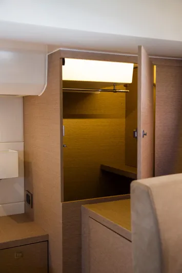 Yacht Photos Pics Interior closet of 2018 Prestige 560 Flybridge yacht, featuring modern design and ample storage.