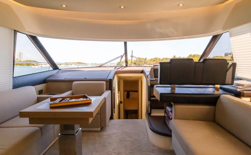  Yacht Photos Pics Interior of 2018 Prestige 560 Flybridge yacht, featuring luxurious seating and modern design.