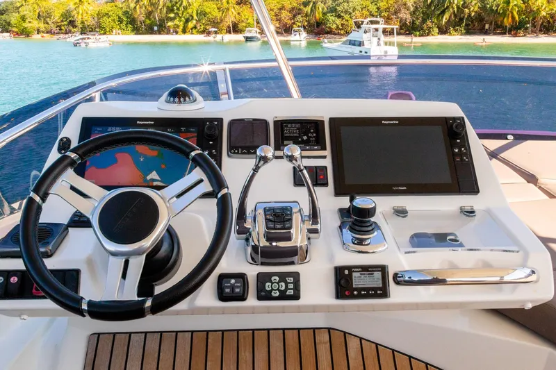  Yacht Photos Pics Cockpit of 2018 Prestige 560 Flybridge yacht with modern navigation equipment.