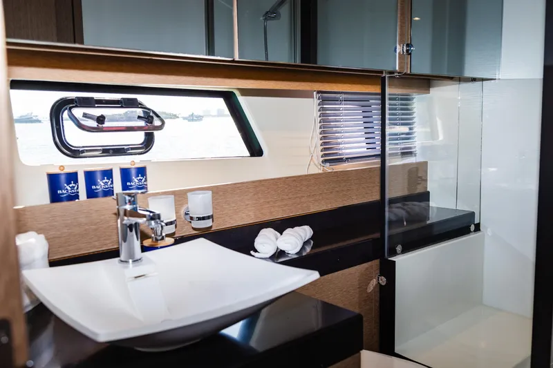  Yacht Photos Pics Luxurious bathroom interior of 2018 Prestige 560 Flybridge yacht with modern fixtures.