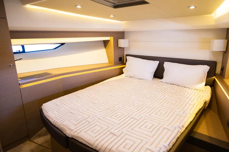  Yacht Photos Pics Luxurious bedroom interior of 2018 Prestige 560 Flybridge yacht with modern design.