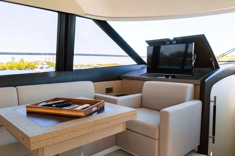  Yacht Photos Pics Interior of 2018 Prestige 560 Flybridge yacht with seating and TV.