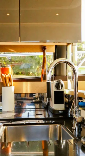  Yacht Photos Pics Modern kitchen interior on 2018 Prestige 560 Flybridge yacht, featuring sleek design and amenities.