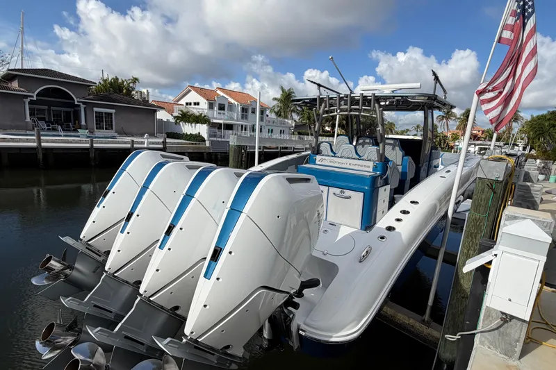  Yacht Photos Pics Midnight Express 43 Open boat docked, featuring four powerful outboard engines.