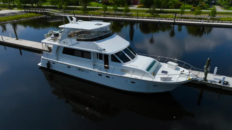 Instead Of Yacht Photos Pics Luxury 2005 Jefferson Marquessa 60 MY yacht docked in serene marina setting.