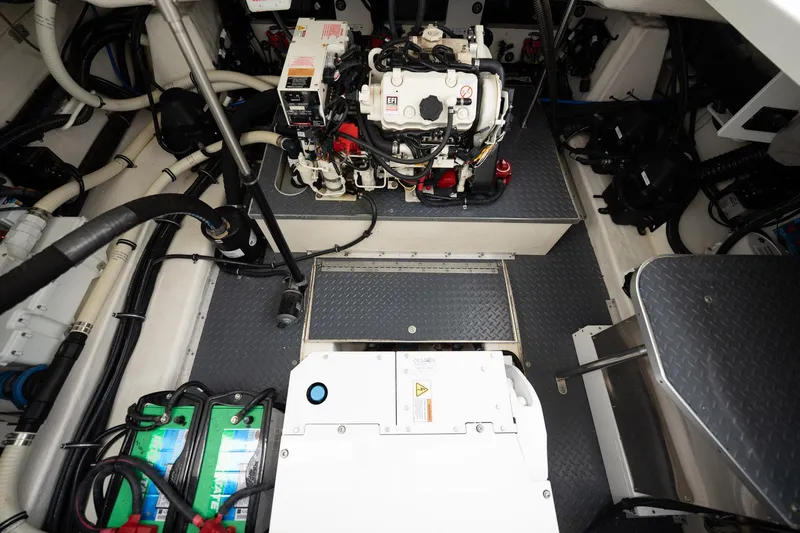 Remarkable III Yacht Photos Pics Engine compartment of a 2019 Formula 350 Crossover Bowrider OB, showcasing mechanical components.