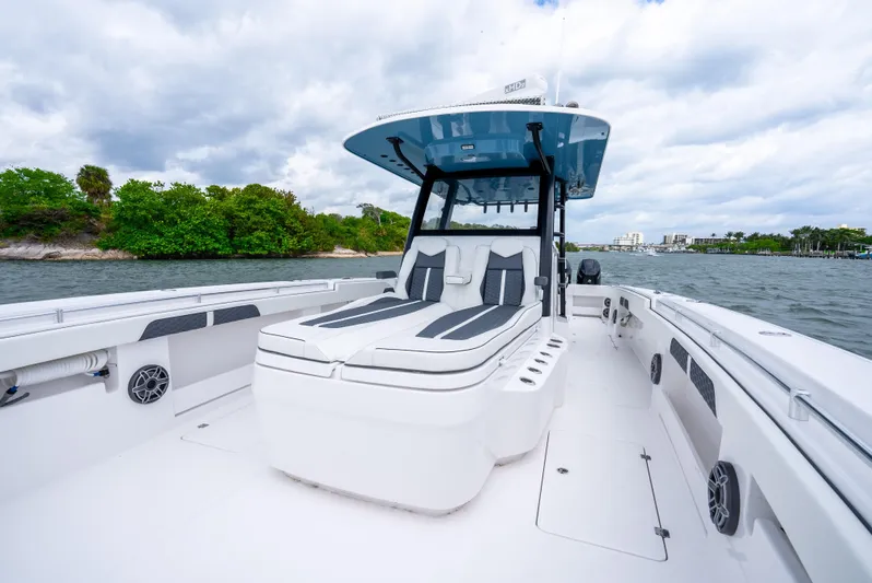 Kroppdustr Yacht Photos Pics 2023 Invincible 37 Catamaran on water, featuring sleek design and spacious deck.