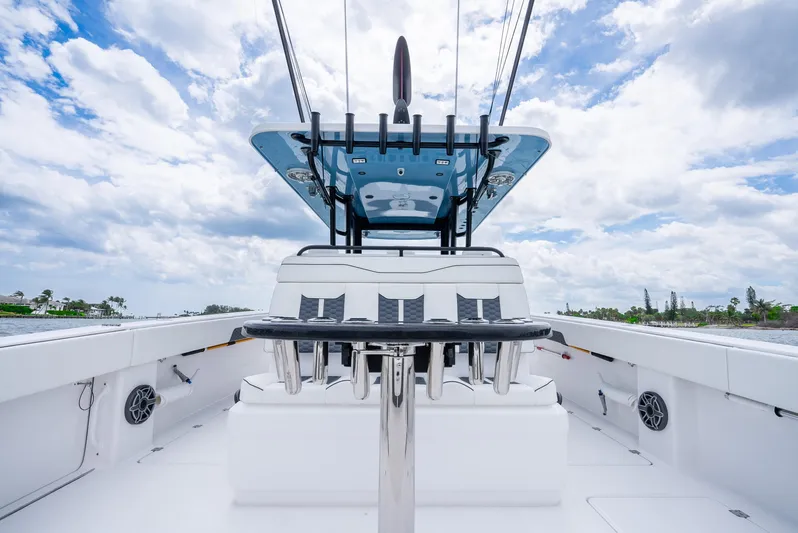 Kroppdustr Yacht Photos Pics 2023 Invincible 37 Catamaran, sleek design, spacious deck, under a partly cloudy sky.