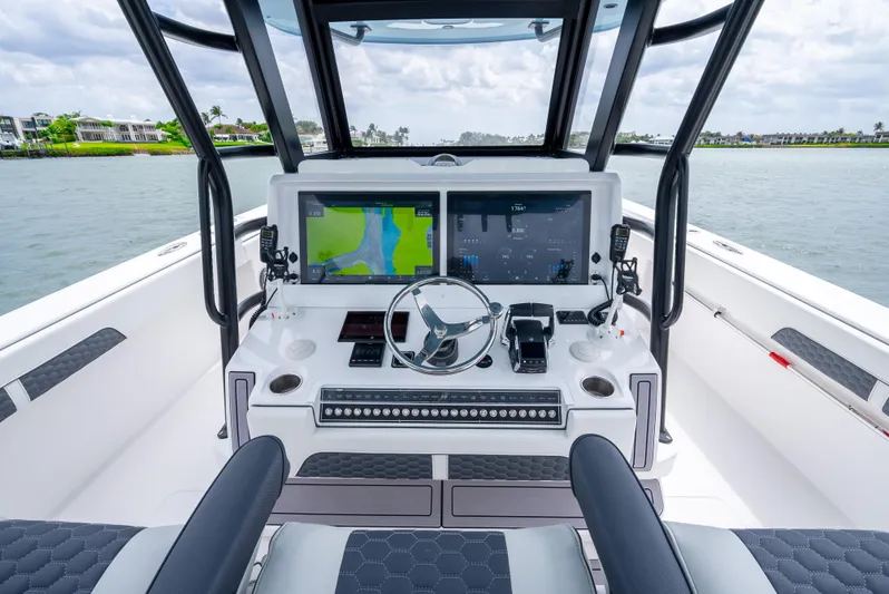 Kroppdustr Yacht Photos Pics 2023 Invincible 37 Catamaran helm with advanced navigation systems and dual screens.