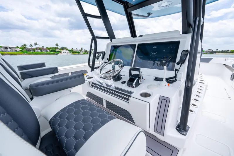 Kroppdustr Yacht Photos Pics 2023 Invincible 37 Catamaran helm with advanced navigation displays and luxurious seating.