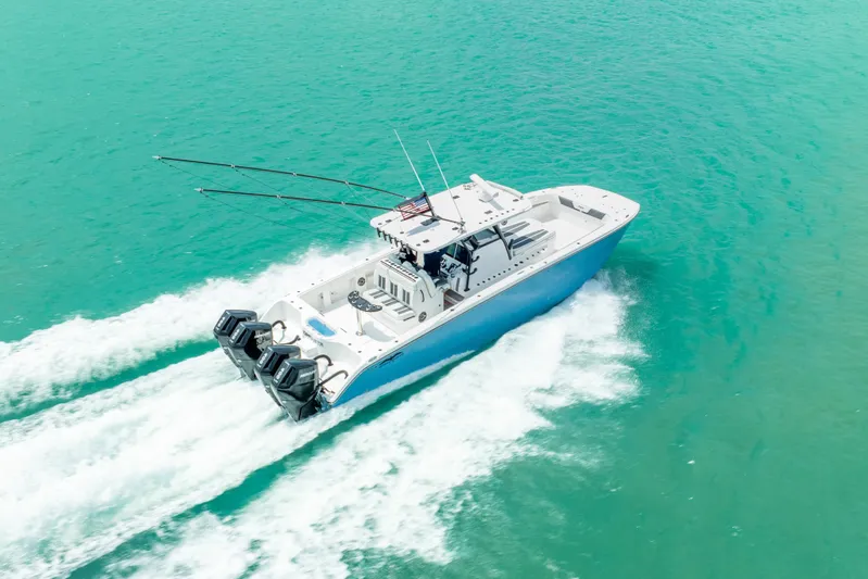 Kroppdustr Yacht Photos Pics 2023 Invincible 37 Catamaran cruising on turquoise water, aerial view.